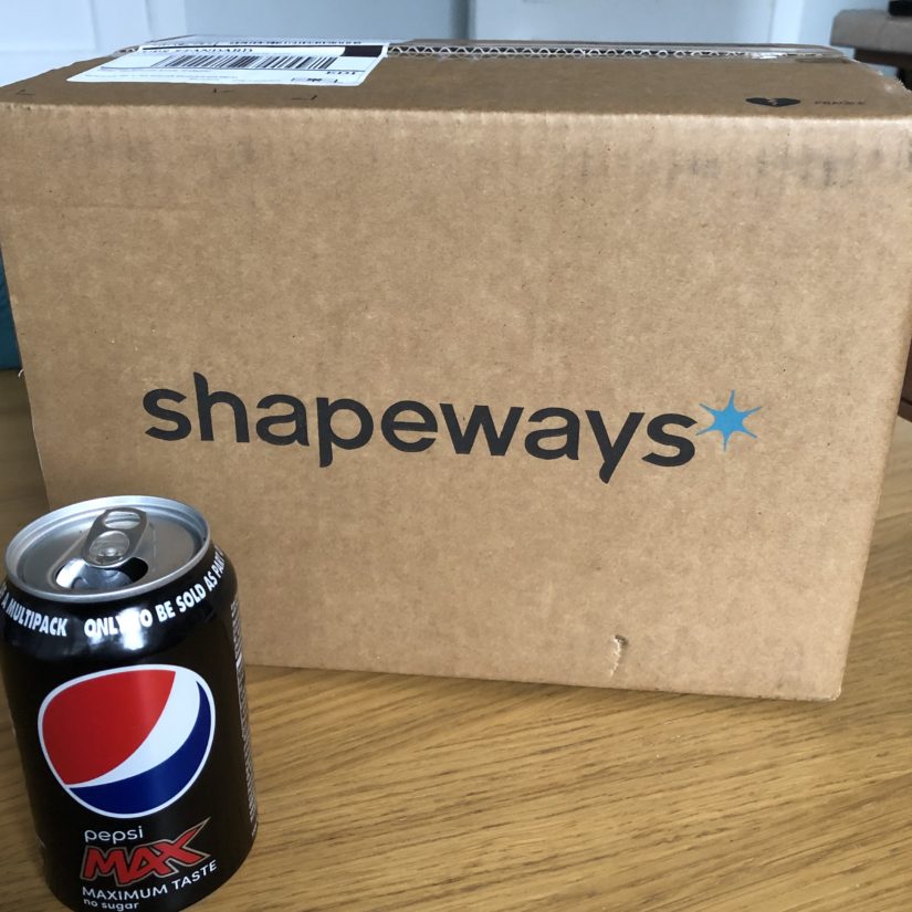 Large shipping box and Pepsi can