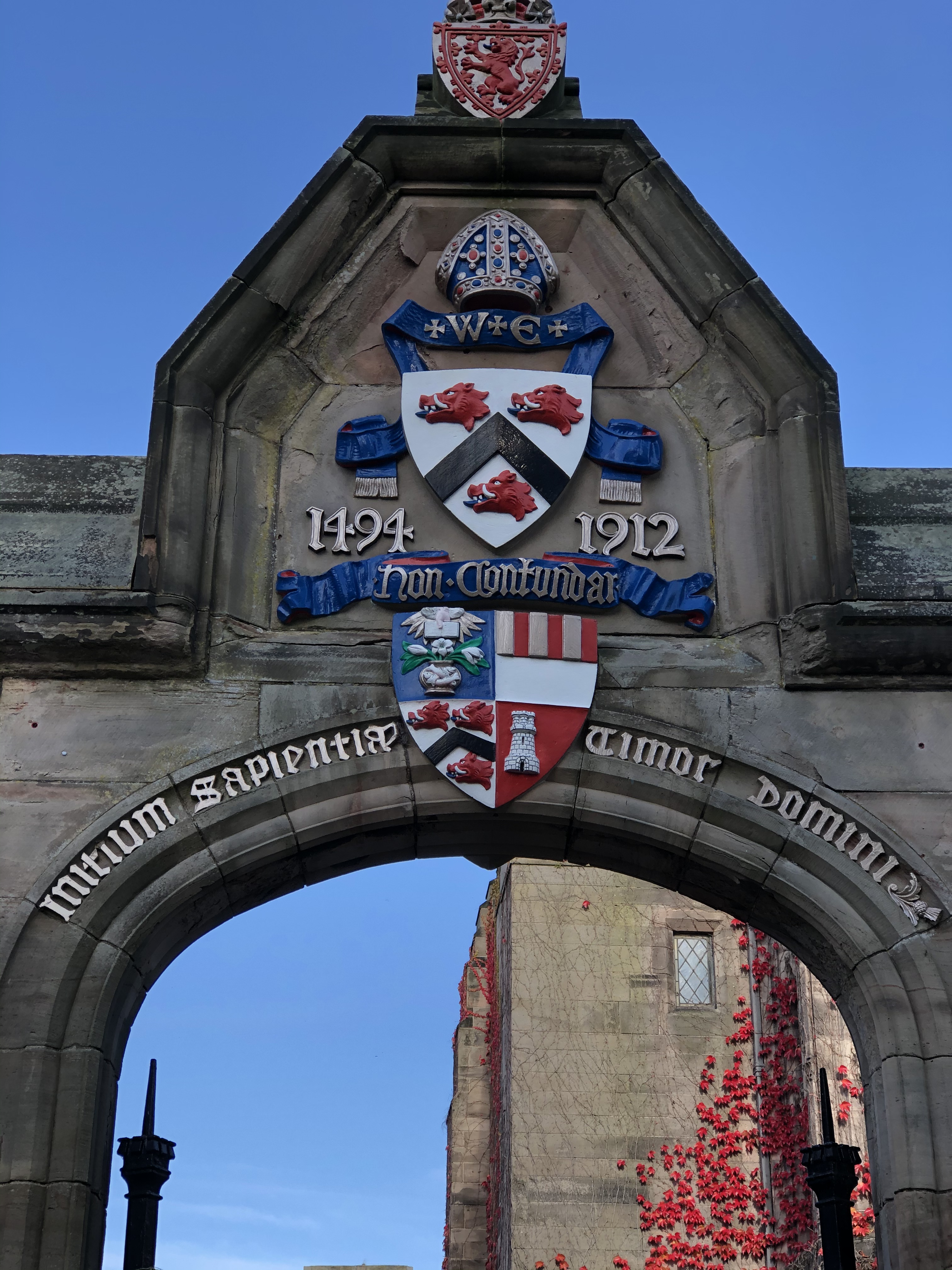 Archway at the university of Aberdeen, beating the university crest and logo